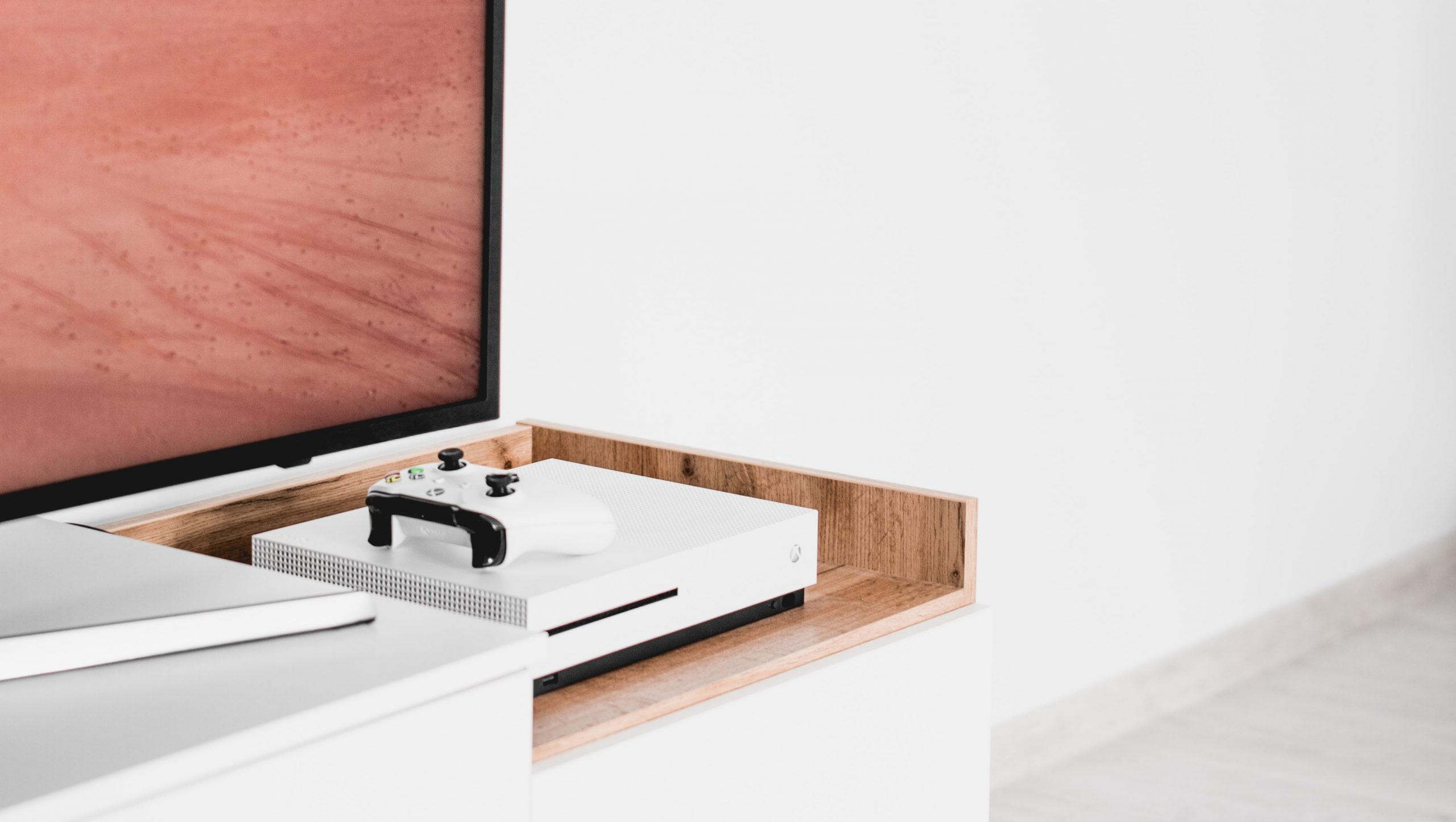 White Xbox One near TV